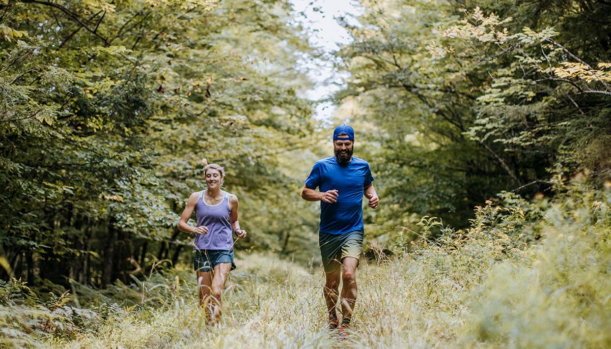 Runners in a forest