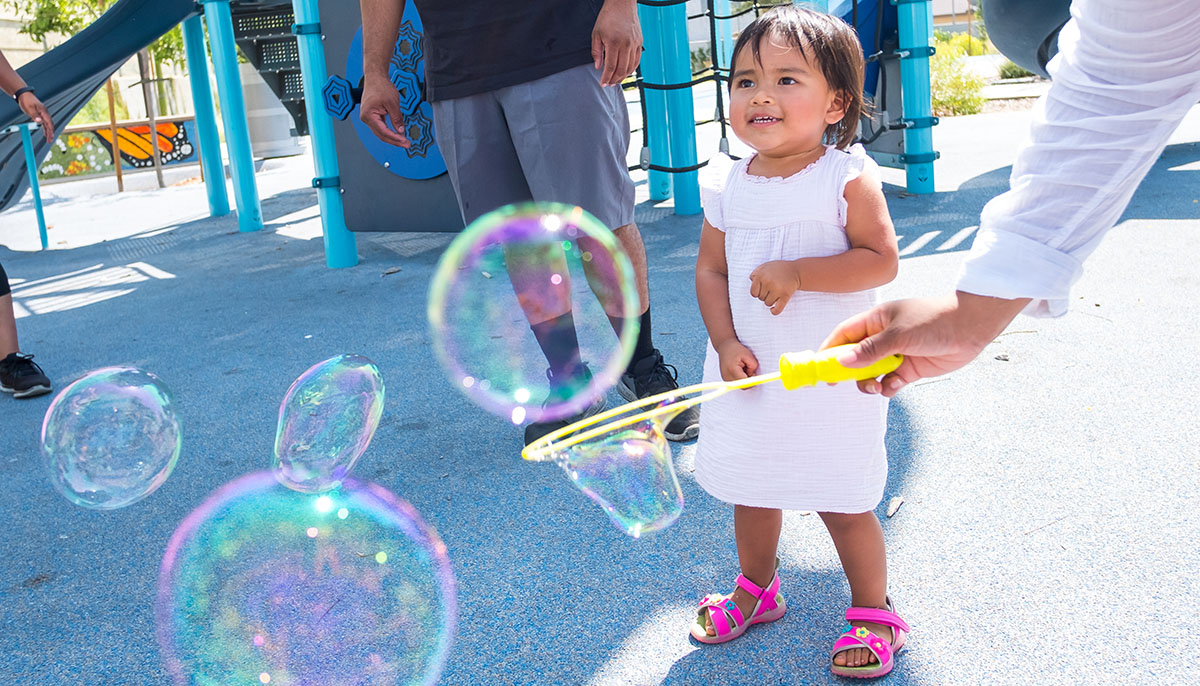 Blowing bubbles at a park